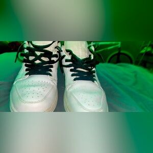 Jordan 1 low triple white used with a small tear in toe box